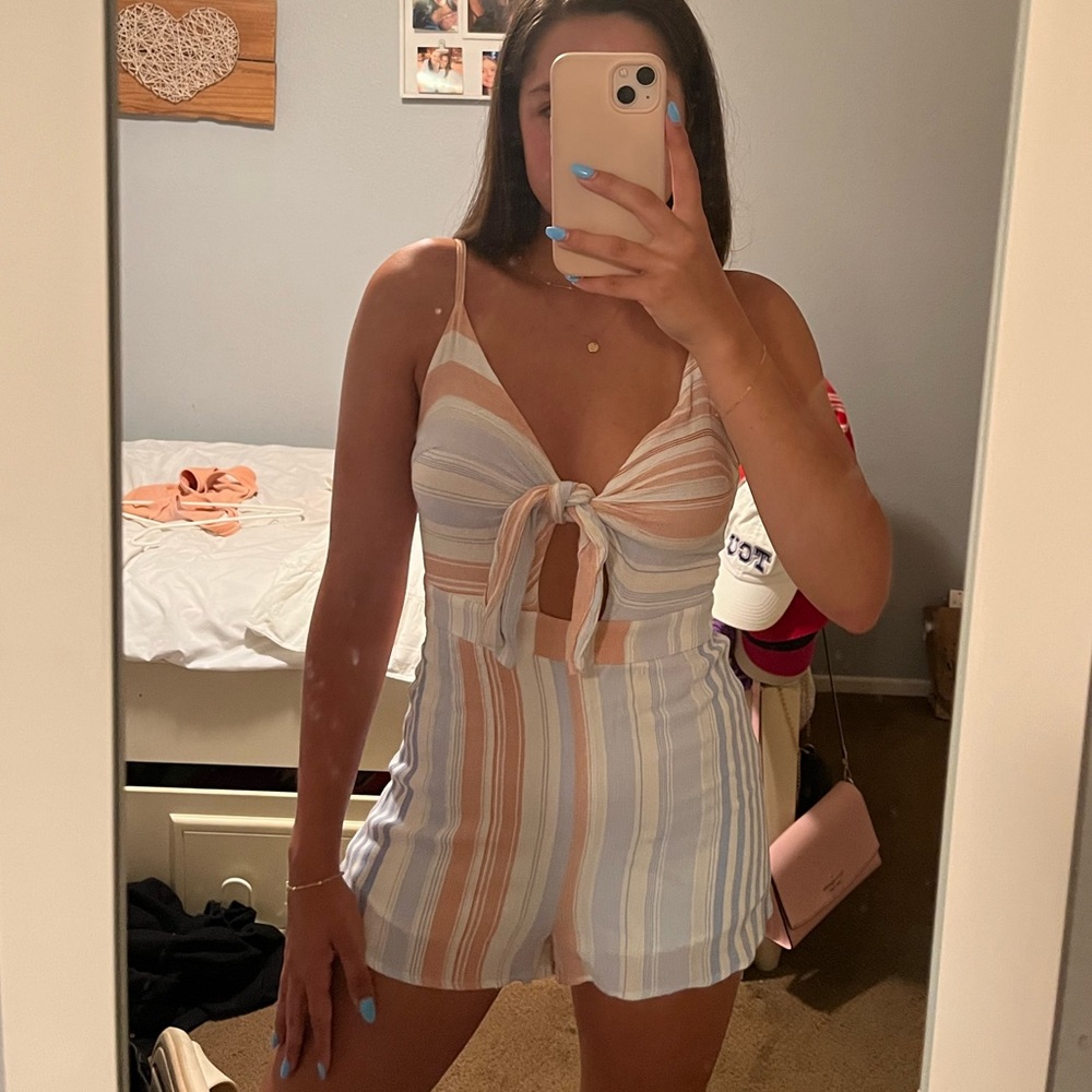 Isabelle’s Cabinet blue and pink romper